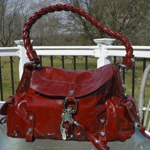 Francesco Biasia ruby red patent leather purse with suede interior front flap